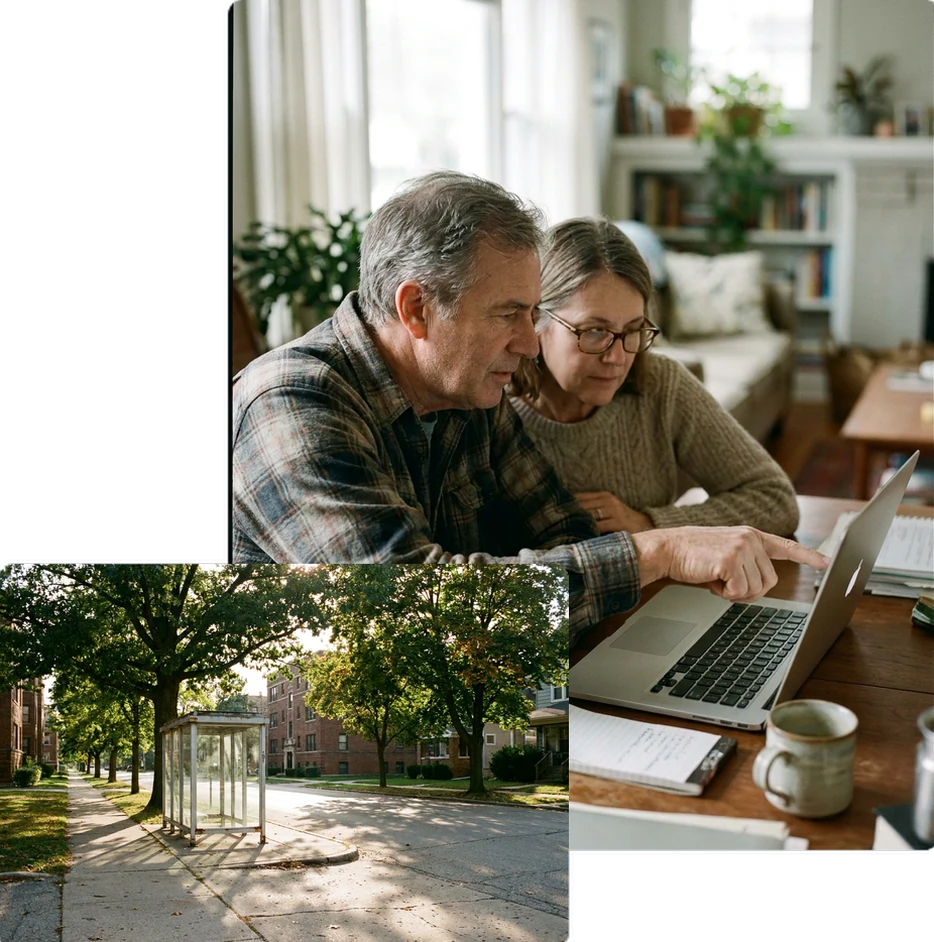 Two people looking at laptop screen, one pointing at it.